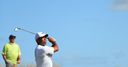 Woods stays in contention