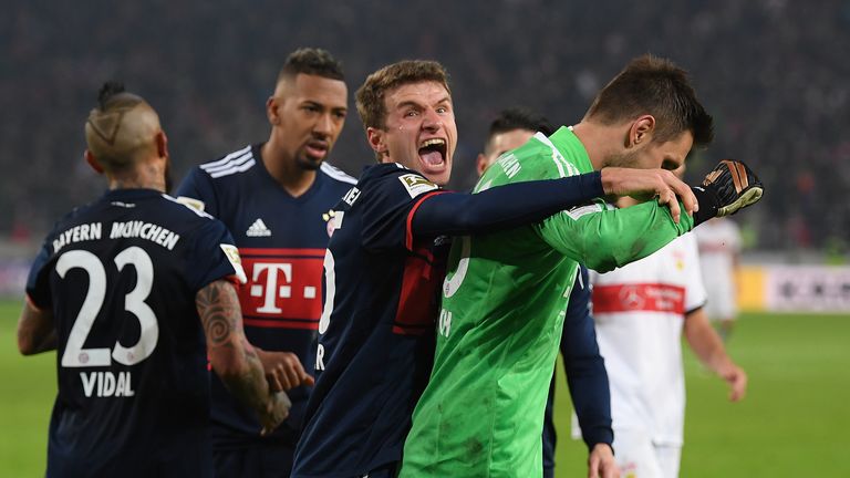 Sven Ulreich is congratulated by Thomas Muller after saving a 95th-minute penalty