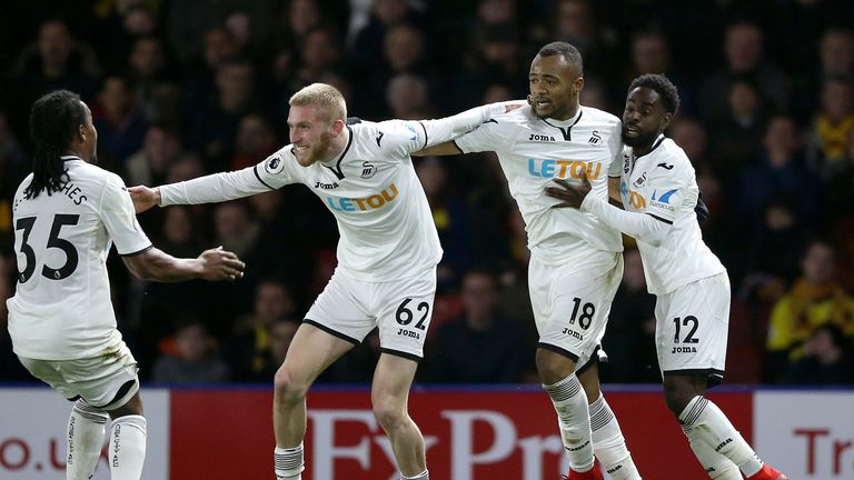 Jordan Ayew (second right) celebrates after equalising late in the game at Vicarage Road