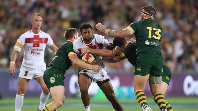 Kallum Watkins takes on the Kangaroos defence