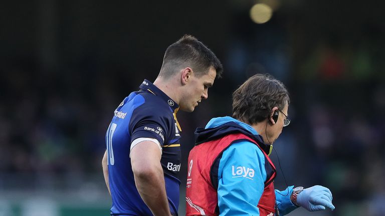 Johnny Sexton leaves the field after suffering an early head injury