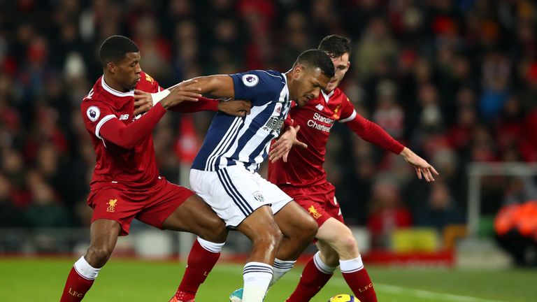 Rondon looks to keep two Liverpool players off the ball