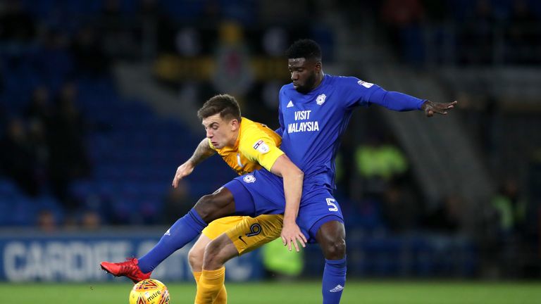 Bruno Manga (R) battles for the ball