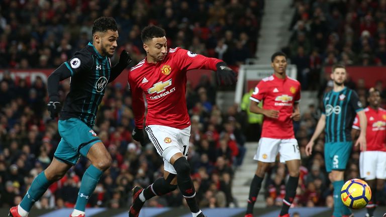 Jesse Lingard under pressure from Sofiane Boufal