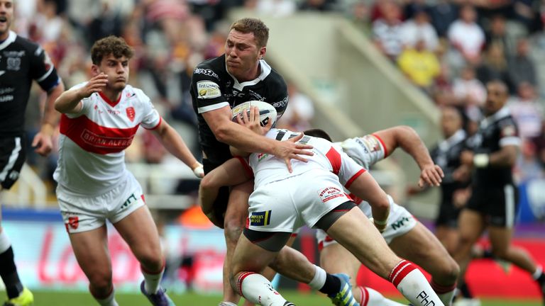 Scott Taylor of Hull FC is tackled by Mitch Allgood of Hull KR, who has since joined St George Illawarra Dragons