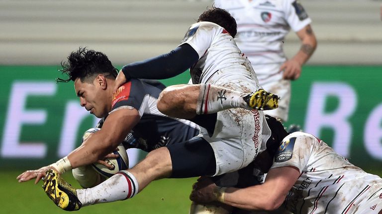 Alex Tulou is brought to ground by the Leicester defence