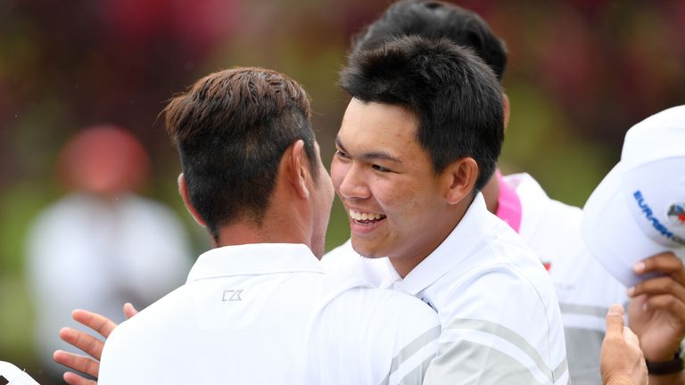 Phachara Khongwatmai and Hideto Tanihara celebrate securing a point