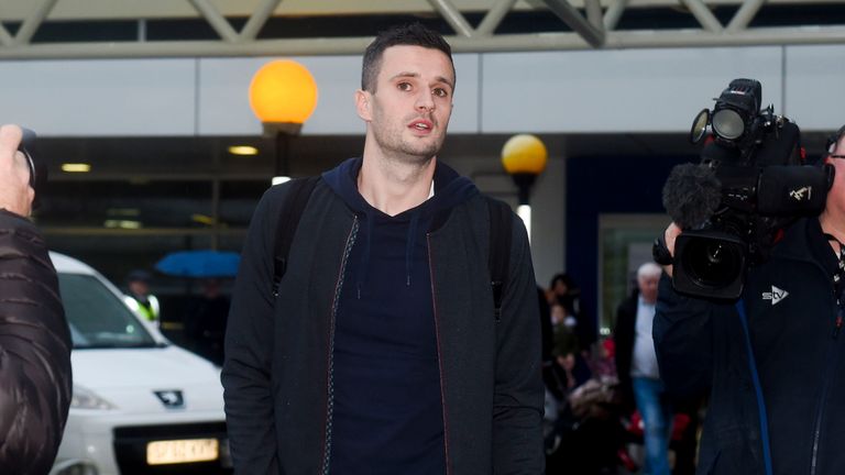 Jamie Murphy arrives at Glasgow Airport