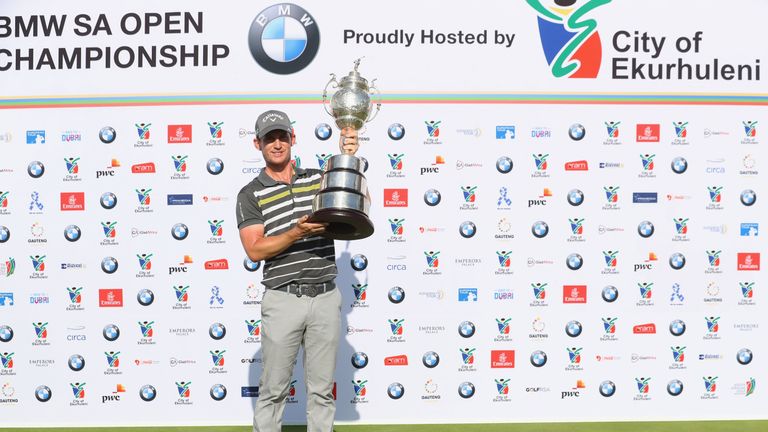 Chris Paisley proudly displays the BMW SA Open trophy
