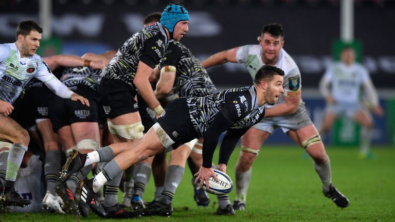 Rhys Webb passes from a scrum