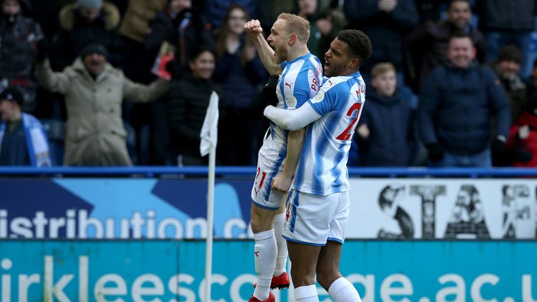 Alex Pritchard is congratulated by Steve Mounie (right) after opening the scoring