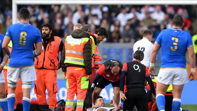 Ben Youngs receives medical treatment after injuring his knee against Italy