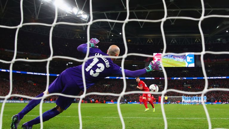 Willy Caballero of Manchester City saves a penalty from Adam Lallana of Liverpool