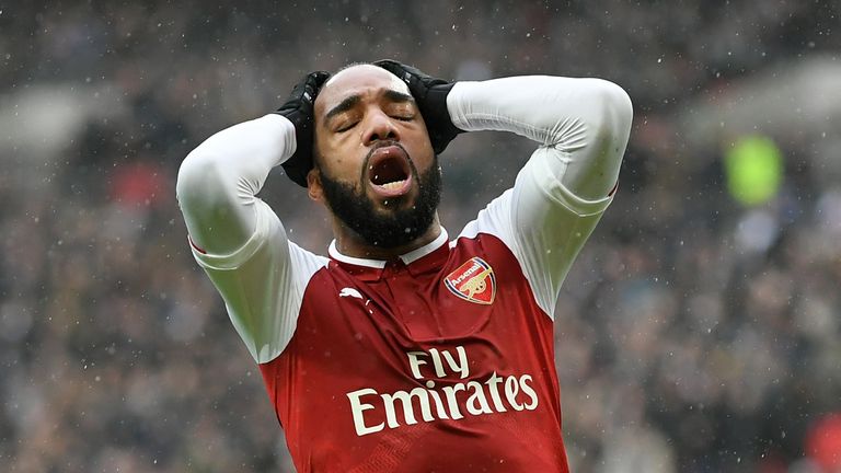 Alexandre Lacazette reacts following a missed chance against Spurs