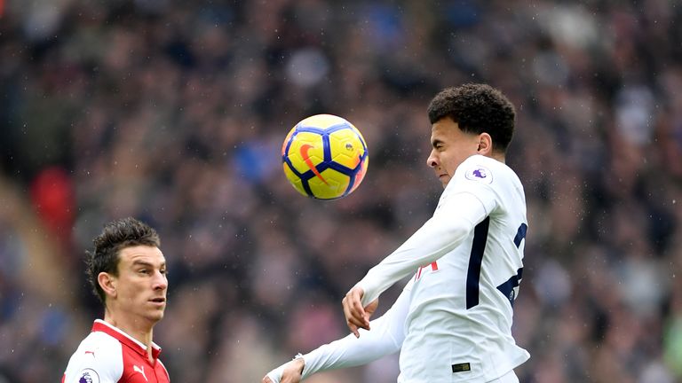 Spurs midfielder Dele Alli battles for the ball in the first half