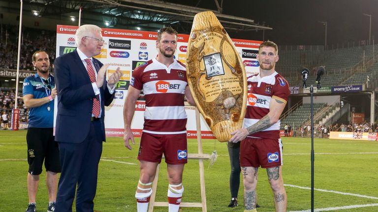 Sean O'Loughlin and Sam Tomkins lift the Kenny Sterling Shield