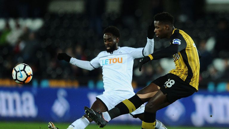 Nathan Dyer tackles Lucas Joao during the game at the Liberty Stadium