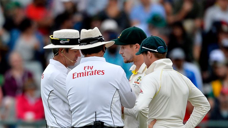 Cameron Bancroft and Steven Smith (right) chatting with the umpires during the controversial Test against South Africa at Newlands