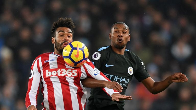 Stoke's Maxim Choupo-Moting (left) shields the ball from Man City midfielder Fernandinho