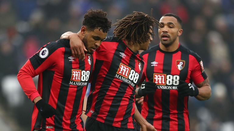 Joshua King (left) is congratulated by Nathan Ake and Callum Wilson after opening the scoring at the King Power
