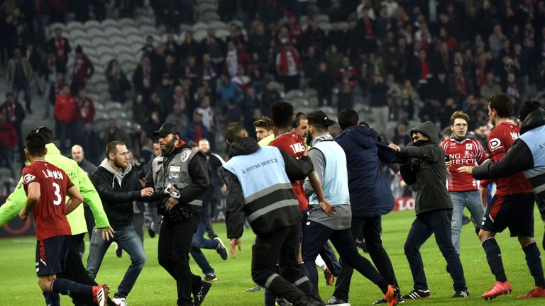 Lille Fans Storm The Pitch After 1-1 Draw With Montpellier Lille Fans Storm The Pitch After 1-1 Draw With Montpellier