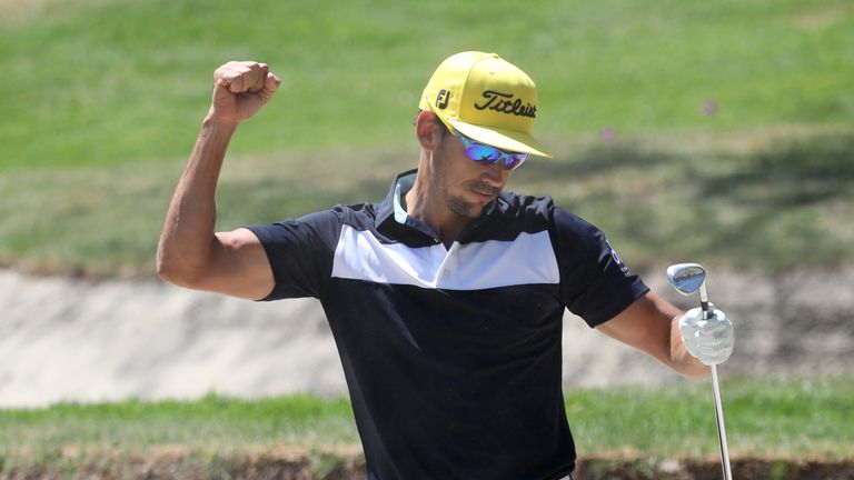 Rafa Cabrera Bello celebrates after holing a bunker shot for an eagle on the first