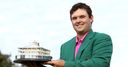 Reed holds on for Masters glory