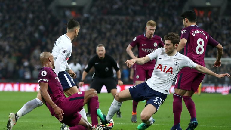 Ben Davies picked up a booking for this challenge on Vincent Kompany