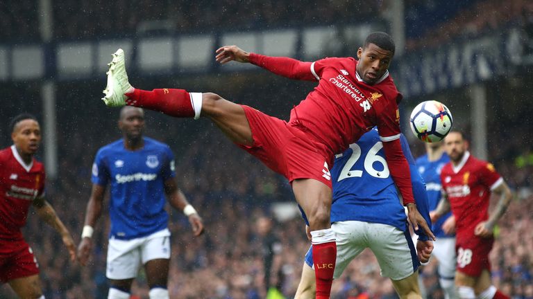 Gini Wijnaldum and Tom Davies compete in the first half at Goodison