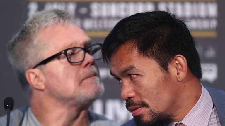 Manny Pacquiao (right) is yet to make a decision on trainer Freddie Roach