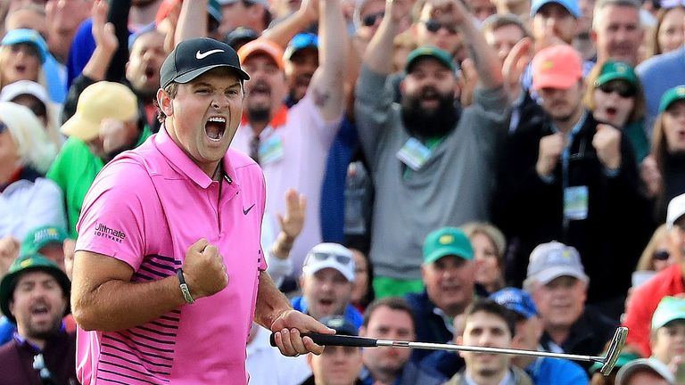 Reed celebrates after making par on the 18th