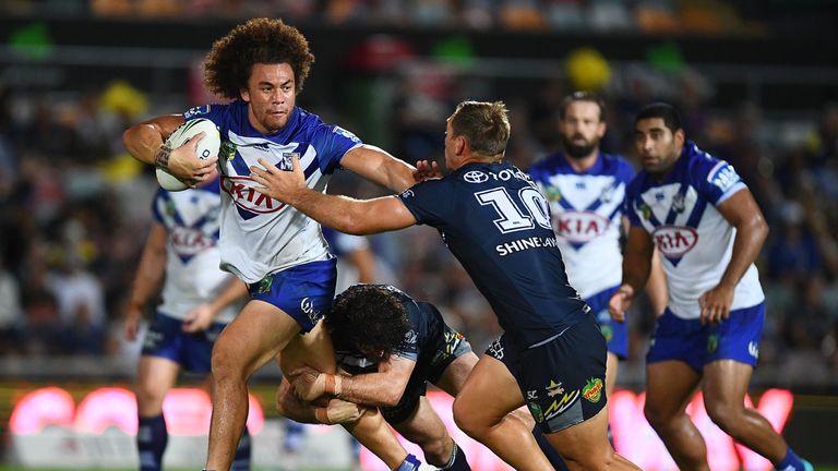 Raymond Faitala-Mariner of the Bulldogs makes a break against the Cowboys