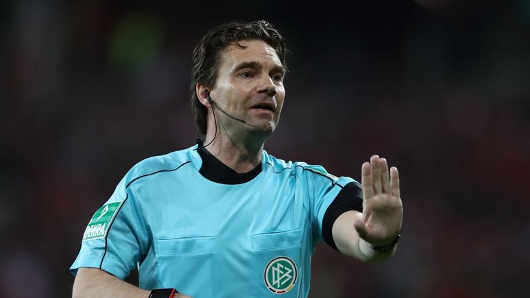 Referee Guido Winkmann referred a potential penalty to the video assistant referee.