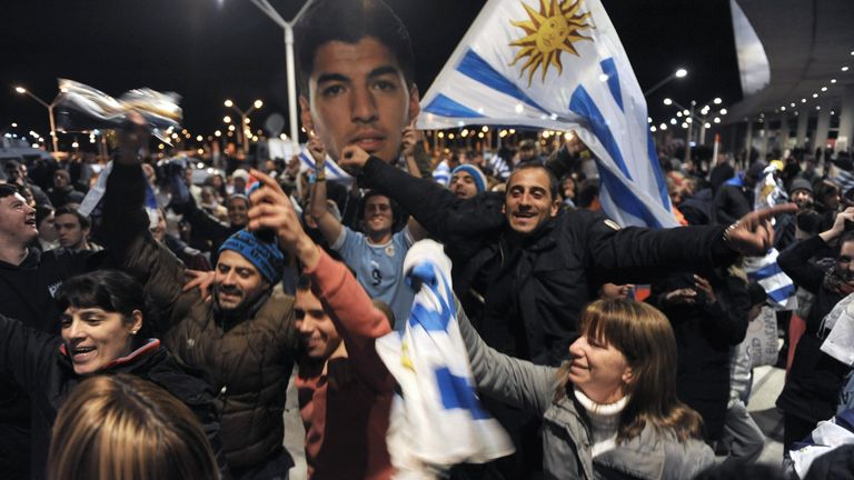 Adoring fans welcome Suarez back in Uruguay after being sent home from the World Cup
