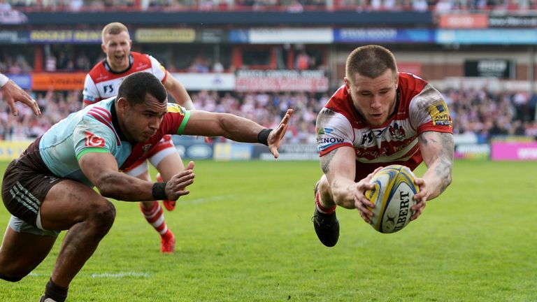 Jason Woodward dives for the line as he scores a try for Gloucester