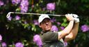 Rory fights back to share lead