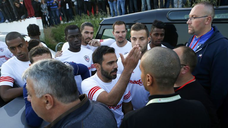 Ajaccio captain Yohann Cavalli tried to speak to Le Havre's players on their team bus