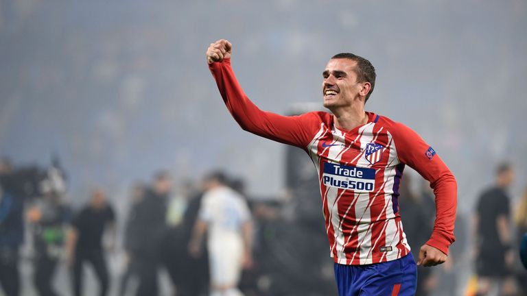 The France international celebrates his first major trophy after four years at Atletico