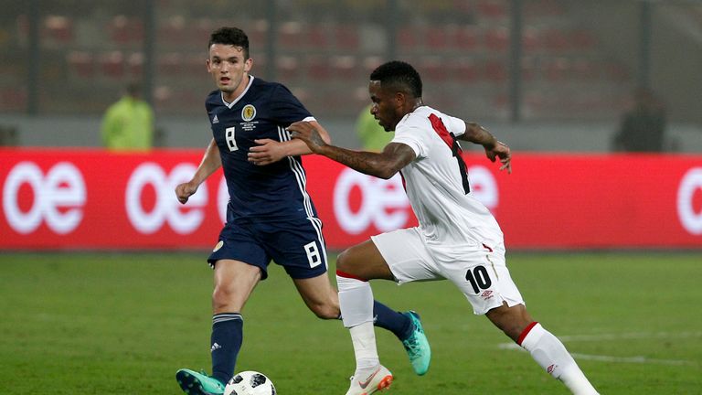 Farfan fights for the ball against John McGinn