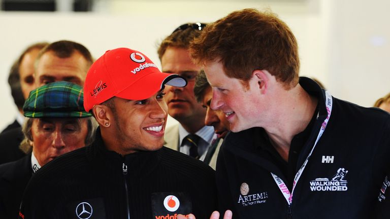 Hamilton with Prince Harry at the 2011 British GP