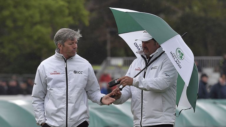 Umpires Nigel Long and Richard Illingworth inspect conditions at Malahide