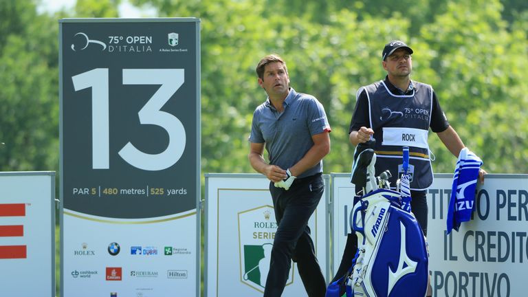 Robert Rock, with former European Tour pro Sam Walker on his bag, shares the first round lead