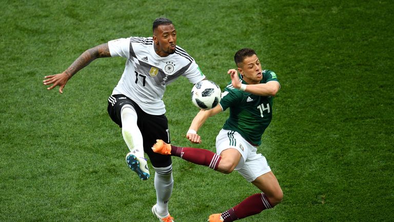 Javier Hernandez is challenged by Jerome Boateng
