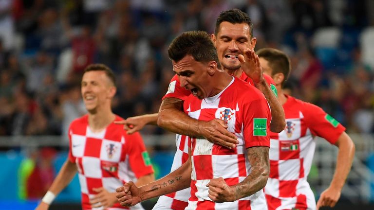 Mario Mandzukic celebrates with team-mates after Nigeria's midfielder Oghenekaro Etebo scored an own goal