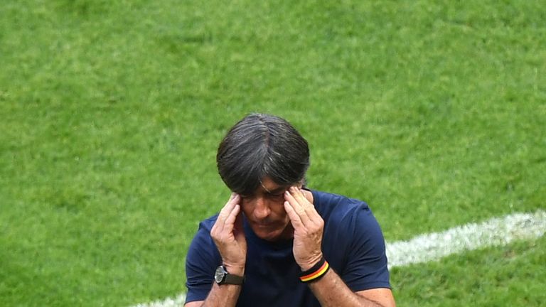 Joachim Low rubs his head during the 2-0 defeat to South Korea