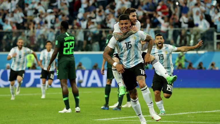 Marcos Rojo and Lionel Messi celebrate the Man Utd defender's late winner