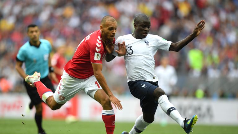 Mathias Jorgensen battles for possession with N'Golo Kante