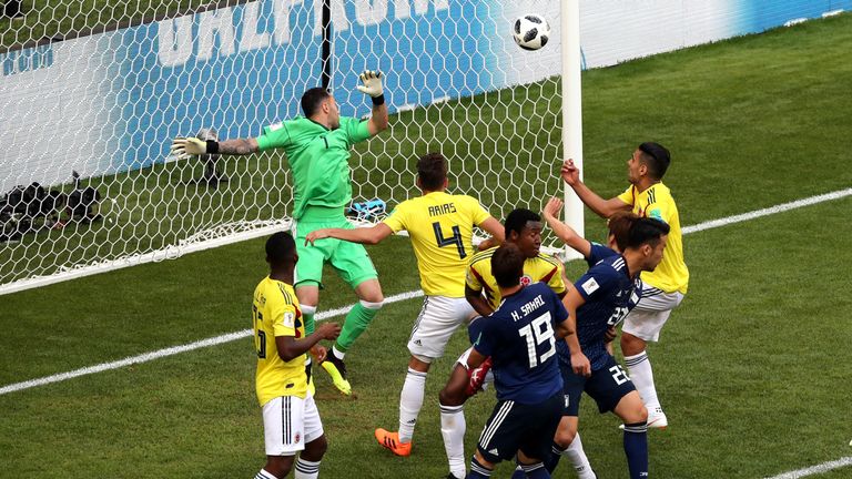 Osako (hidden) watches his header flash past Ospina to make it 2-1