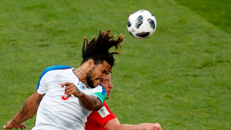 Panama's Roman Torres wins an aerial battle against Belgium