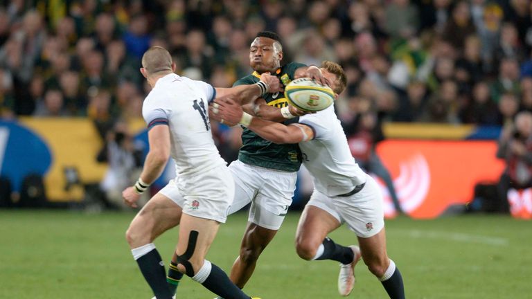 S'busiso Nkosi looks to offload out of the tackle